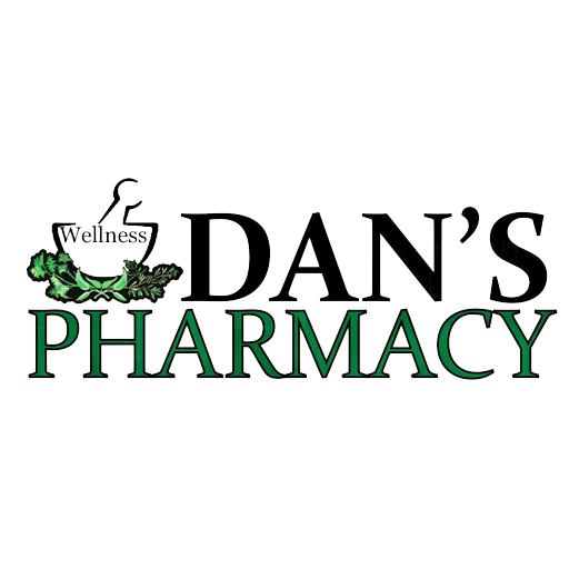 The image features the logo for Dan's Wellness Pharmacy, a Stafford Technologies customer. The design includes a mortar and pestle graphic with the word "Wellness" integrated, surrounded by green leaves, symbolizing natural health and care. The bold black and green text emphasizes the pharmacy's mission to deliver exceptional health and wellness services to the community.